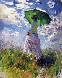 Woman in dress holding umbrella walking on green hill in spring