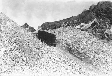 Transport of an enormous convoy containing marble, along a road near a quarry in the Apuan Alps, Tuscany