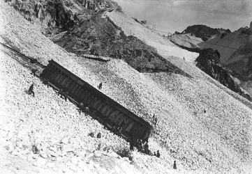 Transport of an enormous convoy containing marble, along the cliffs near a quarry in the Apuan Alps, Tuscany