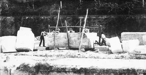 Two machines for squaring off marble at work at a quarry in the Apuan Alps, Tuscany