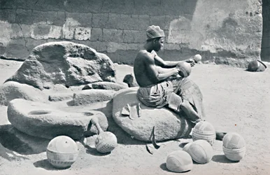 A Yoruba Man Engraving Clay Bowls and Water Jars, Lagos Hinterland, Southern Nigeria, 1912