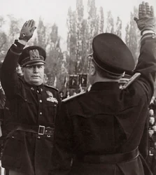 Benito Mussolini Honors a Fascist Official with a Salute