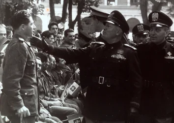 Mussolini Saluting a Soldier