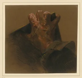Study after a male right hand grasping over the edges of a plate