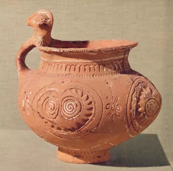 Funerary vase with an anthropomorphic handle