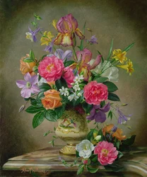 Peonies and irises in a ceramic vase