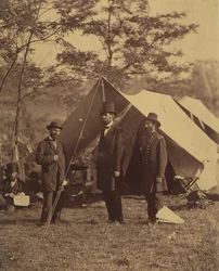 President Abraham Lincoln, Major General John A. McClernand right, and E. J.