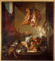 A kitchen interior still life of game, fruit and meat