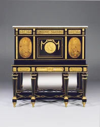 Cabinet-on-stand, incorporating marquetry panels and constructional elements from a commode by David Roentgen, the frieze mounts attributed to Francois Redmond