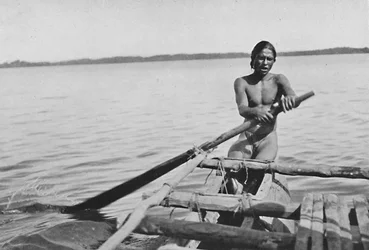 Fisherman on His Canoe