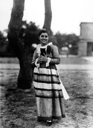Villa Rosa Maltoni Mussolini: portrait of an adolescent holding a small cat, wearing a traditional Italian costume