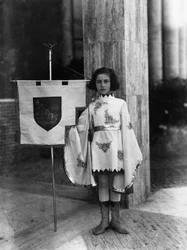 Villa Rosa Maltoni Mussolini: young girl dressed as a page boy with the banner of the city of Rome