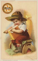 Boy Slicing Loaf of Bread