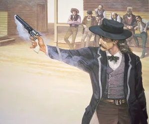 Wild Bill Hickok (1837-76) demonstrates his marksmanship with his Colt Navy model revolver