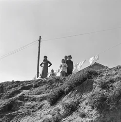 Women and Children Spreading Laundry