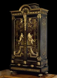 Louis XIV style furniture (1661-1715): wardrobe decorated with figures of Aspasia and Socrates, made of oak, ebony and gilding, c. 1710, Paris. Louvre Museum