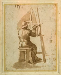 A young painter seated at his easel