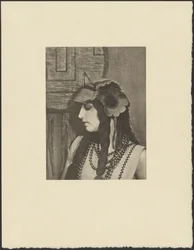 Woman in Bohemian Outfit with Large Flower in Hair