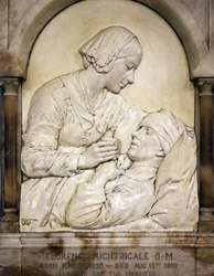 Florence Nightingale comforting a wounded man
