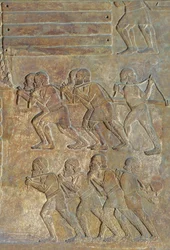 Detail of a relief depicting the stocking up of wood on the shore before transportation by sea, from the Palace of Sargon II, Khorsabad, Iraq