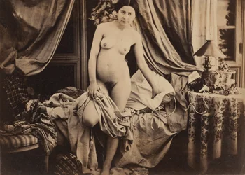 Nude Standing by Bed