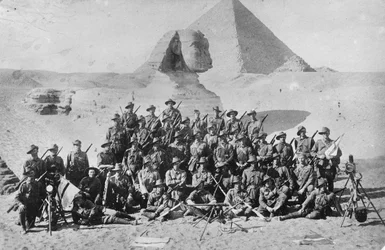 Informal Group Portrait of an Australian Infantry Signal School in Front of the Sphinx and Pyramid. Signalling Equipment is in the Foreground, c.1915