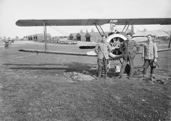 Lieutenants Jack Henry Weingarth, Roy George Smallwood, and Vincent George Sheppard, of No. 4 Squadron, Australian Flying Corps, standing in front of one of the Squadron