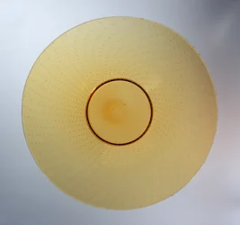 Dish in amber with enclosed bubble pattern, manufactured by James Powell & Sons, c.1938