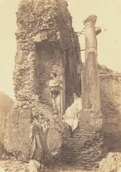 Two Men in Costume Near Ruins