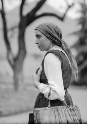 Country woman in traditional conservative clothing, probably Italy but possibly Turkey