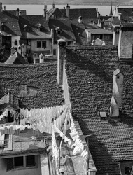 Gabled rooftops and laundry drying on ancient Italian village houses