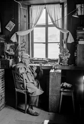 Italian watchmaker with his tools and workbench