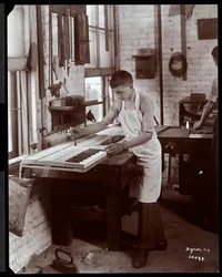 A young man working in the Harrington Piano Co. factory, 1907