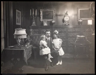 Clarence Mackay with his children in the library of Harbor Hill, in Roslyn, Long Island