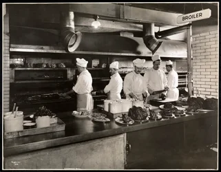 Cooks at the broiler in the kitchen of the Hotel Commodore, 1919