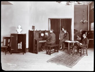 Four Men, One Playing an H. Bruman Co. Player Piano, 1907