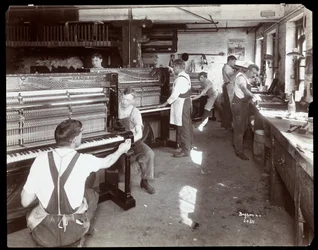 Men working in the Hardman, Peck and Co. piano factory, New York