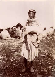 A Shepherd Boy Carrying a Lamb