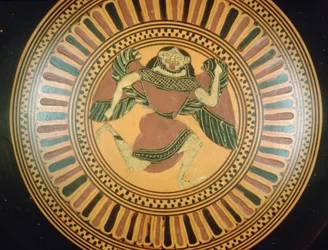 Attic black-figure cup decorated with a running gorgon