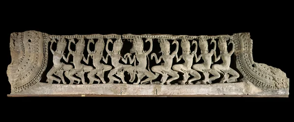 Khmer arts (Far East). Lower pediment register: nine dancing apsaras. Low relief in sandstone, late 12th - early 13th century. Bayon style. From Cambodia, Bayon temple. Paris, Musée Guimet - National Museum of Asian Arts.