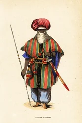 Noble Tuareg warrior of Agadez, Niger, in tagelmust (turban and veil), taktkat (shirt) and akarbey (pants)