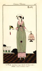 Woman in Striped Linen Dress Holding a Bird and Cage