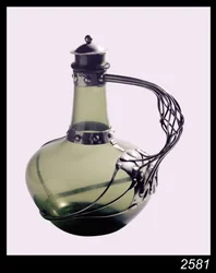 Silver-mounted green glass decanter with makers mark for the Guild of Handicraft, 1901