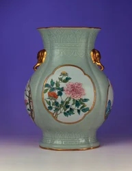 A fine and very rare famille rose celadon-ground vase with a gilt outlined enamel of prunus and roses, one of four enamels depicting the 