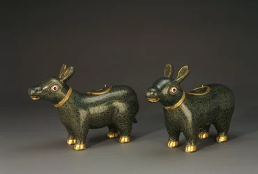 A pair of cloisonne enamel tapir form vessels