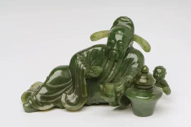 Recumbent Chinese scholar figure