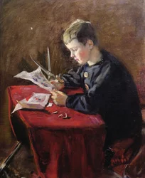Boy cutting Christmas decorations