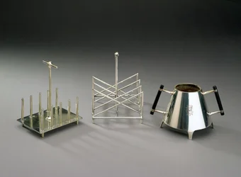 Toast rack with upright supports, manufactured by Hukin & Heath; triangular section toast rack, manufactured by Elkington & Co.; sugar bowl with ebonised wood