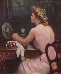 Woman Sitting at Her Dressing Table Looking at a Photograph of a Man
