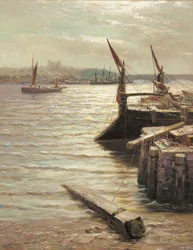 Barges moored by the riverbank